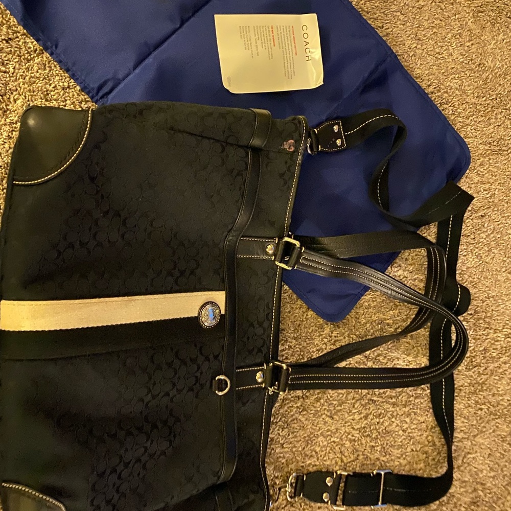 Coach diaper bag and changing pad
